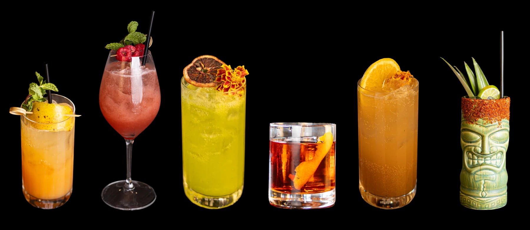 Six cocktails in different glasses, with citrus, flowers, fruit and chile rims